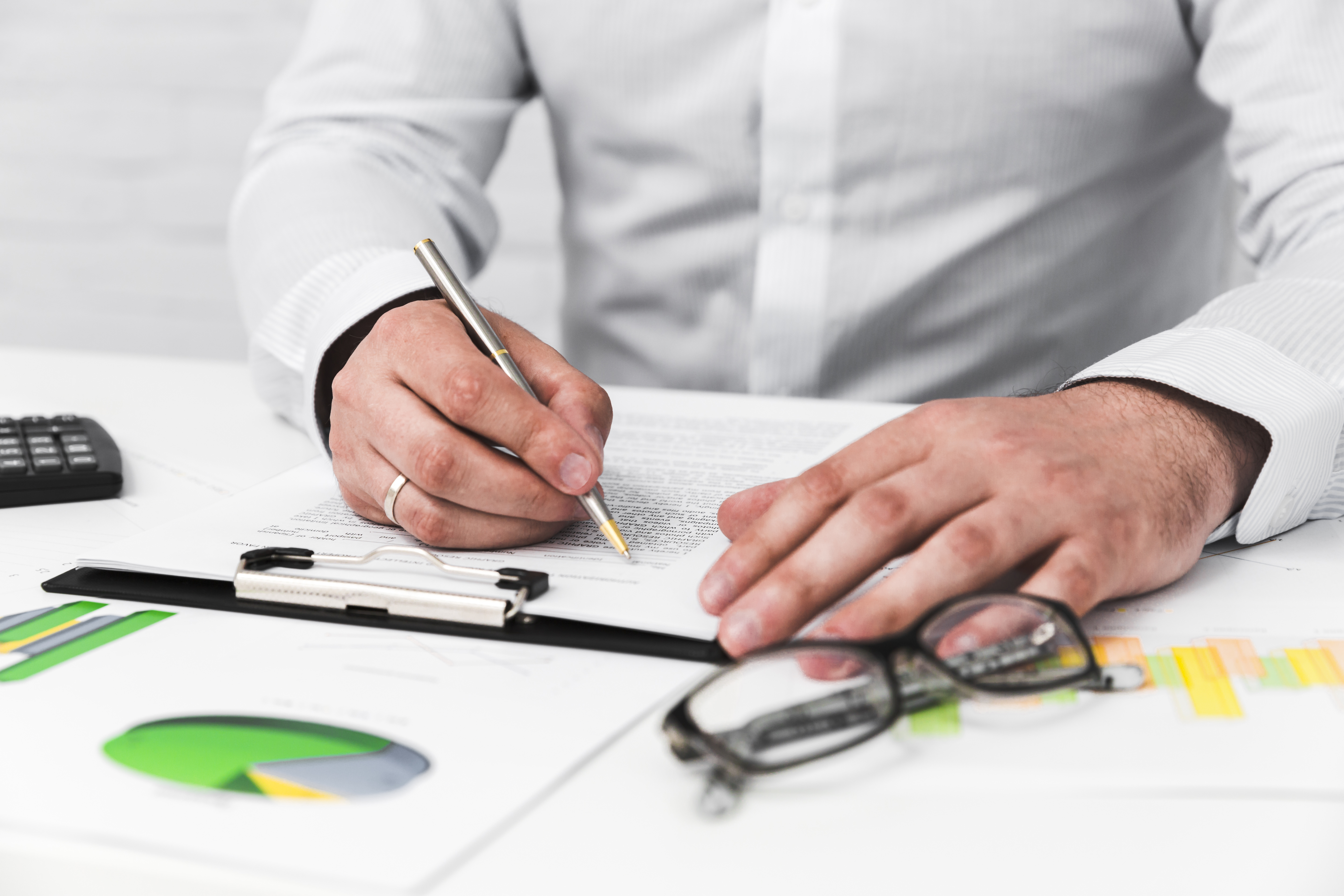 Consultants reviewing audit reports