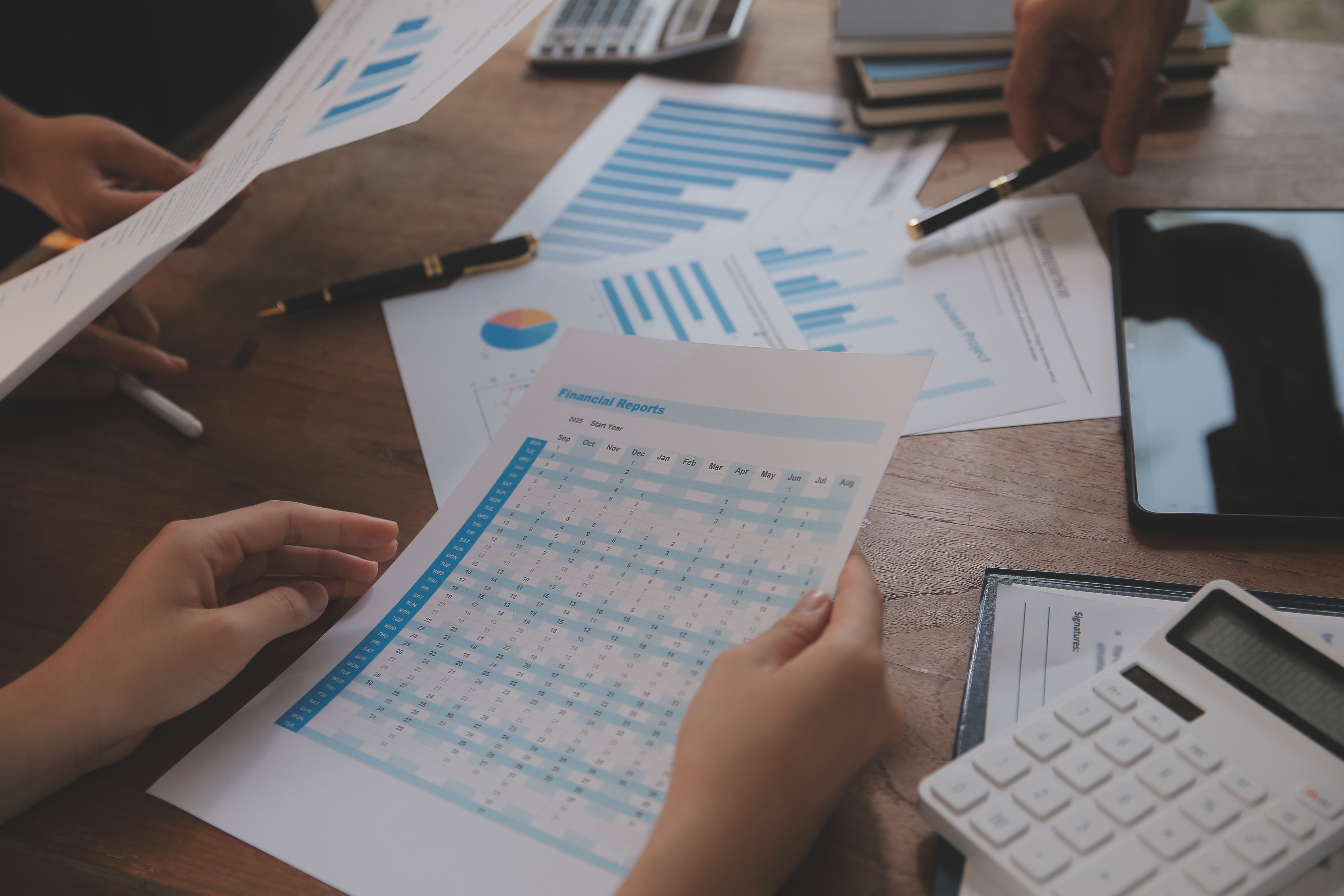 Consultants reviewing audit reports