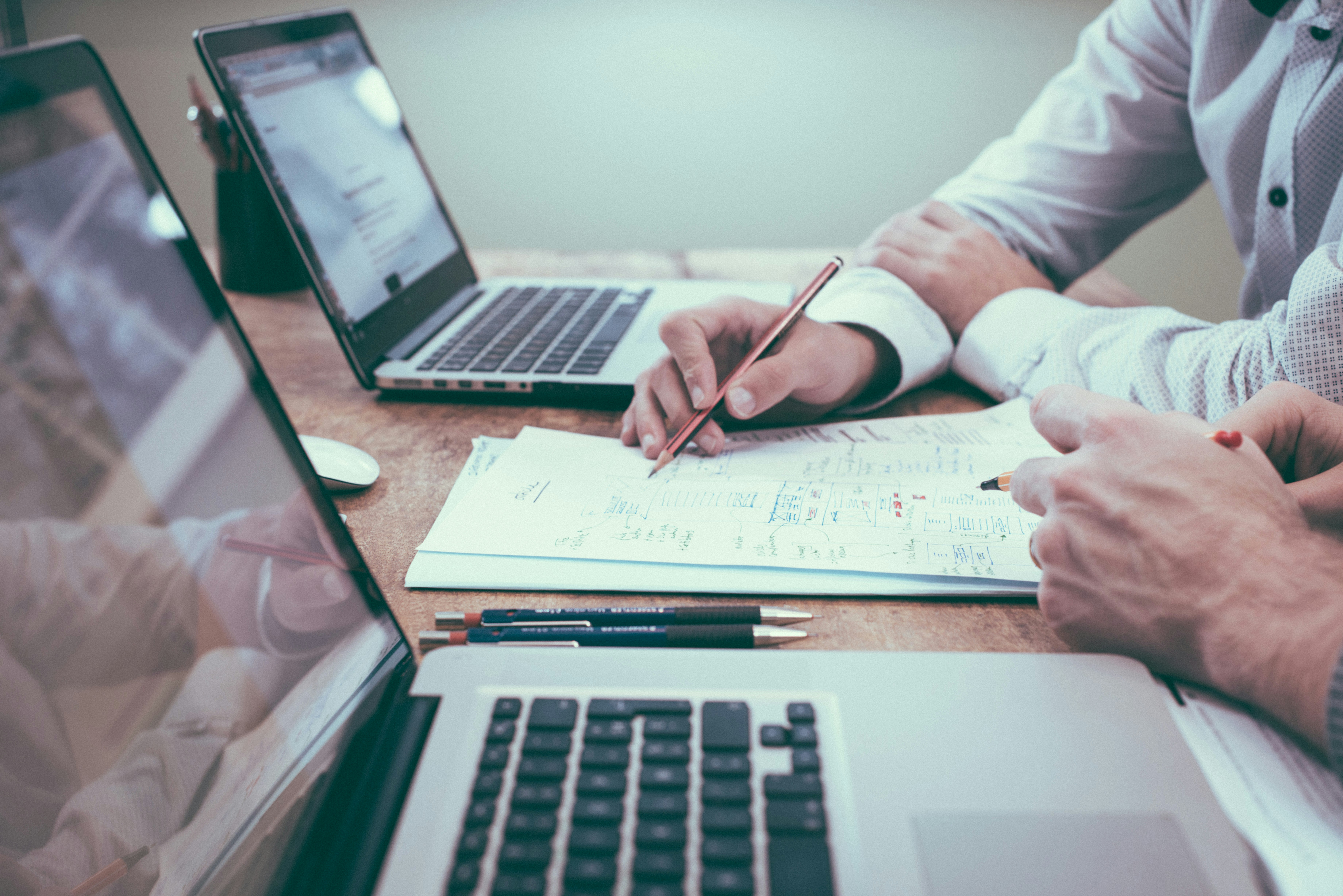Consultants reviewing audit reports