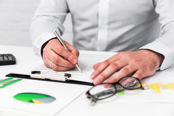 Consultants reviewing audit reports
