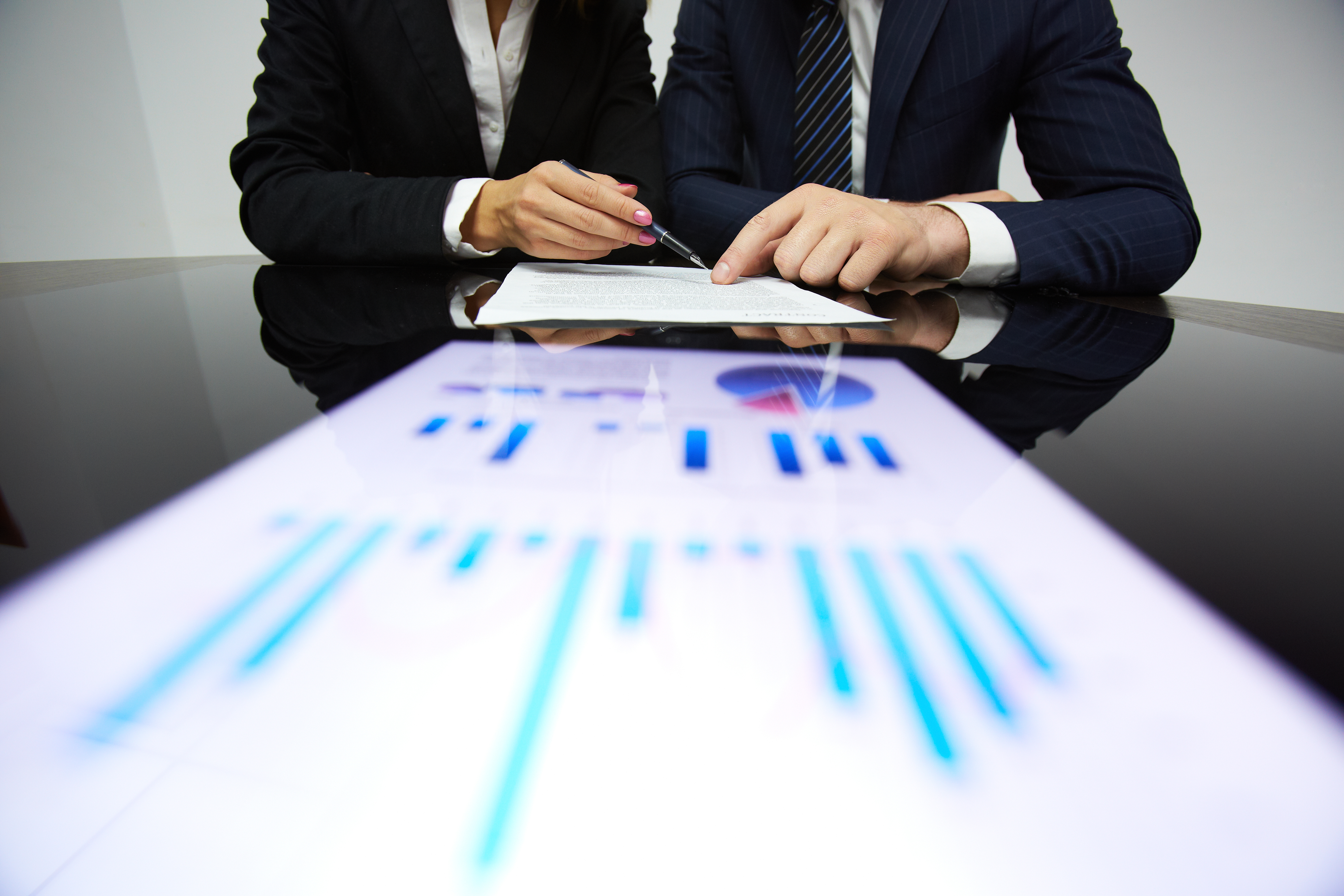 Consultants reviewing audit reports