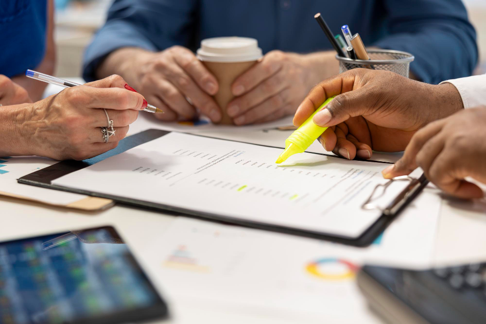 Consultants reviewing audit reports